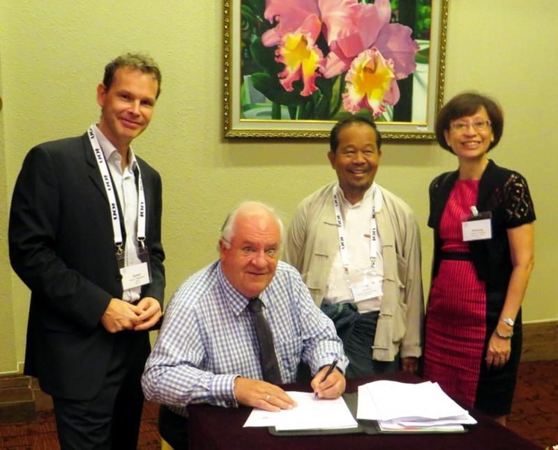 Peter Baillie, President of the AAPG Asia Pacific Region, signing the MOU.  He is flanked on his right by Gerard Wieggerink, Director Asia Pacific, EAGE, and to his left, U Soe Myint, President of Myanmar Geosciences Society and to his extreme left, Ms Adrienne Pereira, Programs Manager, AAPG Asia Pacific Region.