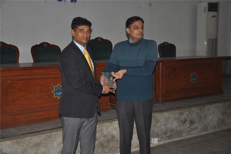 University of Punjub department of chairman presenting a gift to Syed Tariq Hasany
