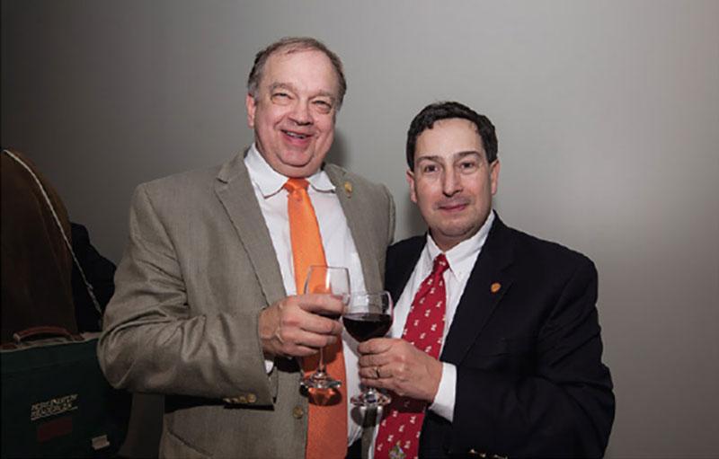 Playmaker 2.0 co-chairs Rick Fritz and Charles Sternbach, share a toast during a celebratory moment at the end of a productive day.