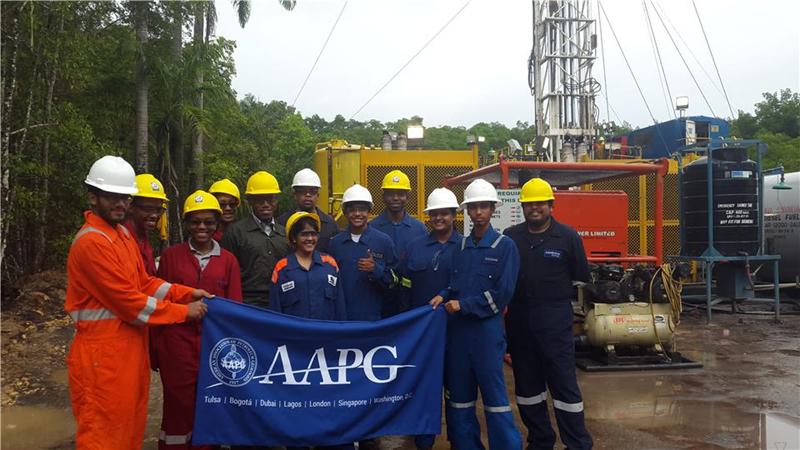 Amrit Cooblal (left), UWI student chapter president and Xavier Moonan (right), trip leader, join participants at the API Petroleum Limited and Sadhna Petroleum Services Company Limited wellsite in Trinidad on July 19.