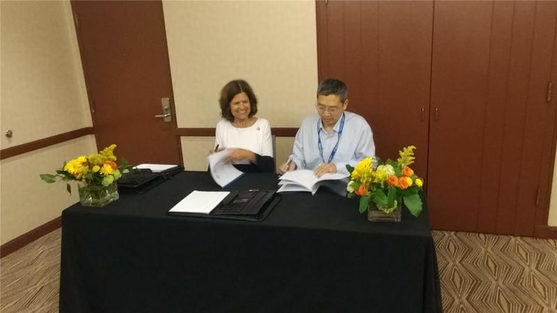 AAPG President-Elect Denise Cox and of Petroleum, Beijing representative, Dr. Nansheng QIU, sign the documents launching the AAPG-CUP Research Center, Beijing.